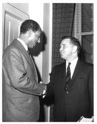 ["Carl Albert shaking hands with Anwar Sadat."]