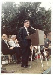 ["Carl Albert at speaker's podium. Dedication of Indian Health Clinic at Tishomingo, Oklahoma. Seated from left: Kenneth Converse, A. S. Mike Monroney, and Overton James. July 13, 1968"]
