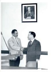 ["Carl Albert with unidentified people."]