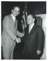 ["Carl Albert with unidentified people."]