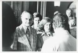 ["Black and white photograph print of an unidentified group of people."]