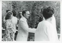 ["Black and white photograph print of an unidentified group of people."]