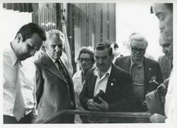 ["Black and white photograph print of Clement Zablocki with George Danielson and several others posing."]