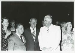 ["Black and white photograph print of Carl Albert, Robert Michel, and several others at the House delegation trip. August 1975"]