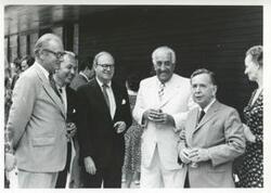 ["Black and white photograph print of Carl Albert standing with several other people. House delegation trip. August 1975"]