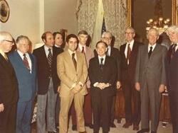 ["Group of men standing together. One man is the speaker from #9123. Among those shown are Carl Albert and Thomas P. O'Neill. Oversized, color."]