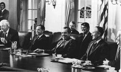 ["Group of men seated at table in White House. Includes Thomas P. O'Neill, Carl Albert, Richard M. Nixon, and Mike Mansfield. Oversized."]