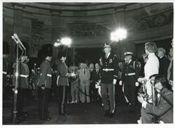 ["Black and white photograph print of several people at a ceremony in the Capitol rotunda honoring arrival of the Magna Carta."]