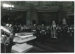 ["Black and white photograph print of several people at a ceremony in the Capitol rotunda honoring arrival of the Magna Carta."]