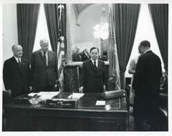 ["Black and white photograph print of Carl Albert, Thomas P. O'Neill, and others in Albert's office. November 1971"]