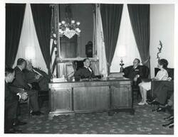 ["Black and white photograph print of Thomas P. O'Neill, Carl Albert, and President Josip B. Tito of Yugoslavia with others sitting in Albert's office. November 1971"]