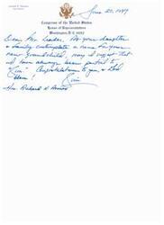 ["The document is a letter from James E. Rogan to Richard K. Armey congratulating him on becoming a grandfather and suggesting the name \"Kim\" for the new grandchild."]