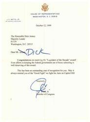 ["J.C. Watts Jr. congratulates Dick Armey on receiving the \"Legislator of the Decade\" award for his efforts in keeping the federal government out of home schooling. Watts commends Armey for his outstanding year of recognition and encourages him to continue fighting for what is right on Capitol Hill."]