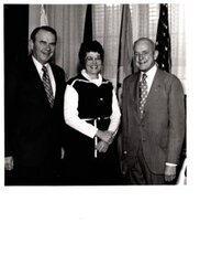 ["The image depicts Dewey Bartlett standing with Henry Bellmon and Jannie Coflis"]