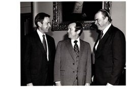 ["The image depicts Dewey Bartlett standing with Henry Bellmon and Howard Baker"]