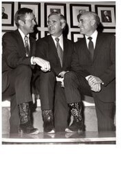 ["The image depicts Dewey Bartlett, Paul Laxalt and Clifford Hansen show off their cowboy boots"]