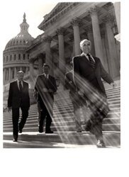 ["The image depicts Dewey Bartlett walking down the Capitol steps with Clifford Hansen and Paul Fanin, and two other men"]