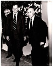 ["The image depicts Dewey Bartlett walking with Clifford Hansen and Nather Ohari"]