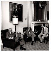 ["The image depicts Dewey Bartlett seated with Howard Baker and Jake Garn"]