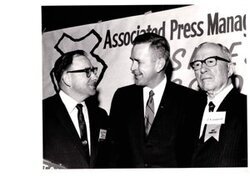 ["The image depicts Dewey Bartlett standing with David Schultz and E. K. Gaylord"]