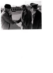 ["The image depicts Dewey Bartlett shaking hands with John O. Thisler"]