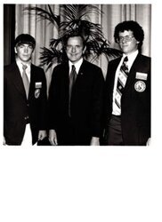 ["The image depicts Dewey Bartlett standing between Kurt Cunningham and Richard Klein, two West Virginia National Youth Space Camp members"]