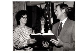 ["The image depicts Dewey Bartlett standing with the Oklahoma spelling champ, Beth Underwood and Virginia Nolan"]
