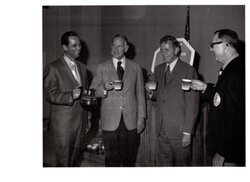 ["The image depicts Dewey Bartlett shaking hands with Jack Ward, who is representing the Oklahoma Restaurant Association and owner of Ward's Cafeteria"]
