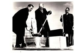 ["The image depicts Dewey Bartlett officiating with Robert King and Clifford W. Barrett, President, American Trailers, Inc., pouring the corner stone of their new plant at Northwest 10th Street and Morgan Road, Oklahoma City, Oklahoma"]