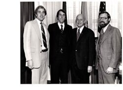 ["The image depicts Dewey Bartlett standing with Bob Dotchin (minority staff director of Small Business Committee), Stan Inwardy (minority staff counsel Small Business Committee) and Mike Roush (economist)"]