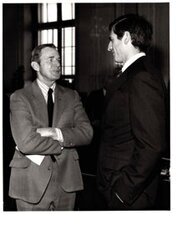 ["The image depicts Dewey Bartlett standing talking with John Danforth"]