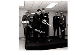 ["The image depicts Dewey Bartlett at a ribbon cutting for the 3M Plant Dedication in Weatherford"]