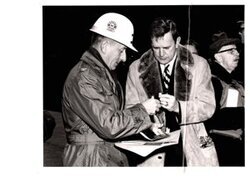 ["The image depicts Dewey Bartlett standing with Colonel Vernon W. Pinkey, District Engineer"]