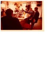 ["The image depicts Dewey Bartlett seated at a food bar eating lunch aboard the Sergeant Floyd with Tulsa District Engineer, Colonel Anthony A. Smith, during visits to the Bicentennial Towboat at Sallisaw, Oklahoma"]