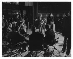 ["LaDonna Harris and her grandmother Wakkie Tabbytite at the Anadarko Indian Exposition The women are in a car in a parade LaDonna is shaking hands with an unidentified man July 1965"]