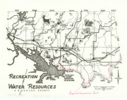 ["The map showcases Sequoyah County, Oklahoma, highlighting its highways, waterways, cities, and towns, along with the Tenkiller Ferry Reservoir and the proposed Short Mountain Reservoir. It includes annotations in red indicating a proposed commercial road along the Arkansas River. This topographical map measures 8 1/16 by 10 1/2 inches and is both inscribed and annotated."]
