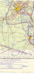 ["This map is a section of an aviation chart of Arkansas, highlighting the density hours for Little Rock and Pine Bluff, marked in red. It was originally part of a document related to an Interim Report. An index card detailing the item's origin is attached. The aviation chart is in color and measures 11 5/8 by 5 11/16 inches, with inscriptions and annotations."]