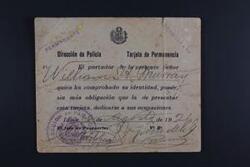 ["The document is a police card granting Williams Murray permission to go about his activities after his identity has been verified. The card is dated and signed by the Chief of Passports."]