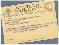 ["The document is about a telegram urging support for HR 1752 from the American Legion Department of Oklahoma. It also provides information about the classification of the telegram and the symbols used. The message is addressed to George B Schwabe in Washington DC."]