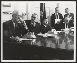 ["Information in title from back of photo. Stamp: American Telephone & Telegraph Company. Subject: Cable - submarine Japan - Hawaii. Description: Opening ceremonies transpacific Cable - Washington. Date: 6-18-64. Photog.: Reni News Photo Svc. Wash, DC."]