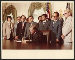 ["Written on post-it: S. 1047 Signing internment commission bill July 31 1980. Pres. Jimmy Carter. Stamp: Official Photograph The White House Washington."]