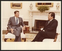 ["Written on post-it: Pres Reagan discussing AWACS sale to Saudi Arabia in oval office 10/20/1981. Stamp: Official Photograph The White House Washington."]