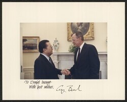 ["Signed on front: To Daniel Inouye With best wishes, George Bush. Stamp: Official White House photograph."]