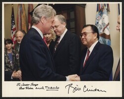 ["Signed on front: To Senator Inouye, Best wishes, and thanks, Bill Clinton. Information in title from attachment. Stamp: Official White House photograph."]