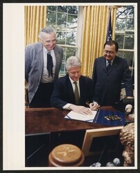 ["Caption: Bill signing ceremony for S. 1965 The Sand Creek National Historic Site Study Act October 6, 1998. Stamp: Official White House photograph."]