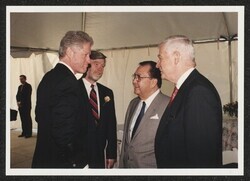 ["Caption: DKI with Pres. Clinton at FDR Memorial dedication, DC May 1997. Written on sticker: Official 1209. Official 1172 FDR Memorial dedication 5/2/97. Label: (c) 1997, Martin H. Simon."]