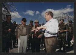 ["Caption: Sec. of Defense Donald Rumsfeld travels to Camp X-Ray, Guantanamo Bay, Cuba w/Inouye & Stevens. Jan. 27, 2002. Photo: Helene Stikkel."]