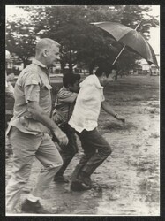 ["Caption: Inspection of flood damage in Central Luzon, Philippines, 1973. (L) Robert K. 'Bob' Rogers, State Dept., AID."]