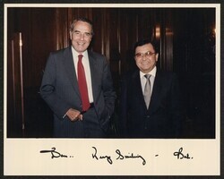 ["Signed on front: Dan ... Keep smiling - Bob. Stamp: U.S. Senate Photograph."]