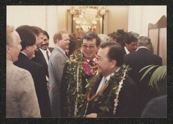 ["Information in title from attachment. DKI at Henry's reception, January 1987. Photo from Jeff Watanabe, Honolulu."]